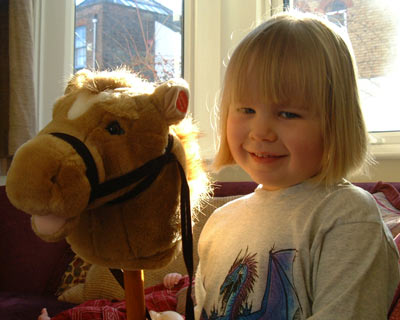 Marianne and a hobby horse, backlit; I'm dead pleased with this photo
