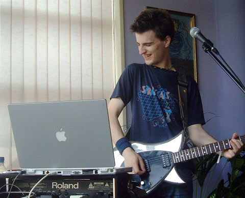 Jim Moray playing electric guitar and PowerBook